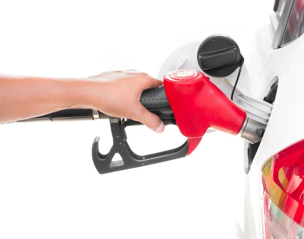 Hand holding gasoline nozzle filling up a car isolated on white — Stock Photo, Image