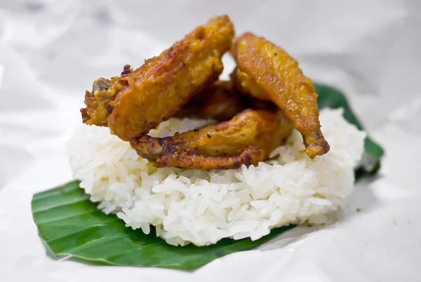 Fried chicken wing on sticky rice — Stock Photo, Image