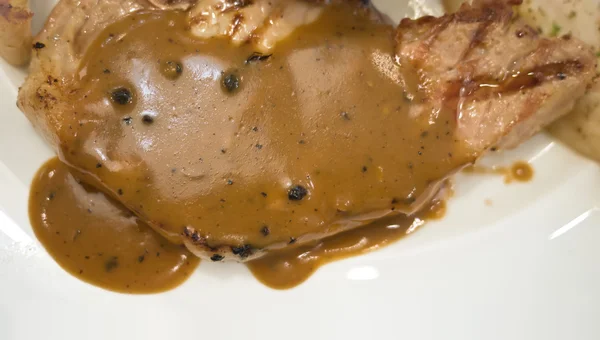 Pork chop steak with gravy sauce — Stock Photo, Image