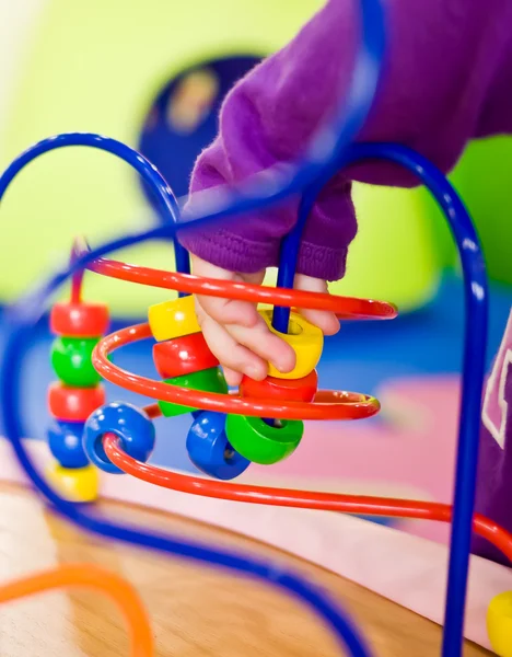 Children playing bead roller coaster — Stock Photo, Image