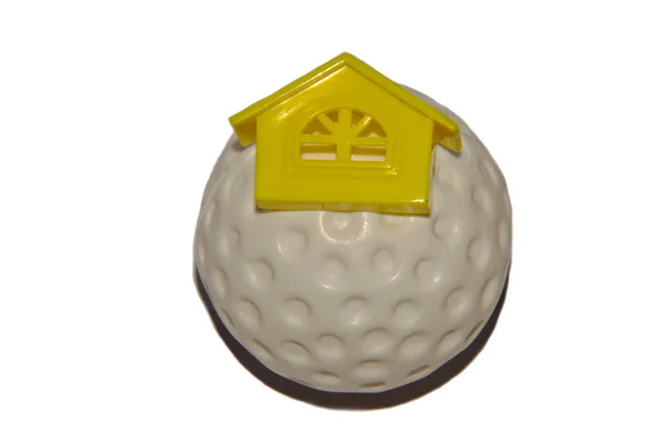 Casa na bola de golfe — Fotografia de Stock