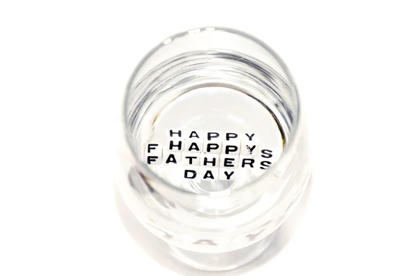 Happy Fathers Day letters reflecting in water — Stock Photo, Image