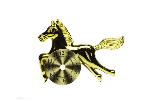 Kultainen hevonen kellolla — kuvapankkivalokuva