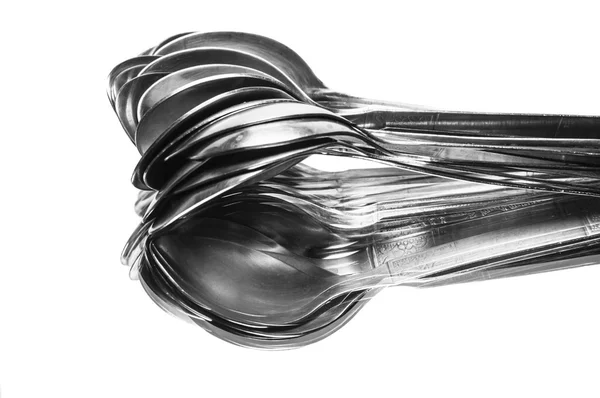 Spoons on reflective surface — Stock Photo, Image