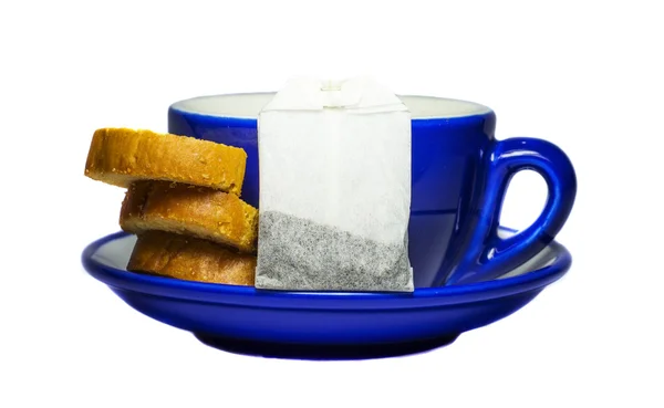 Sušenky čajové sáčky a pohár — Stock fotografie