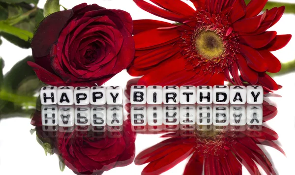 Happy birthday with red flowers — Stock Photo, Image