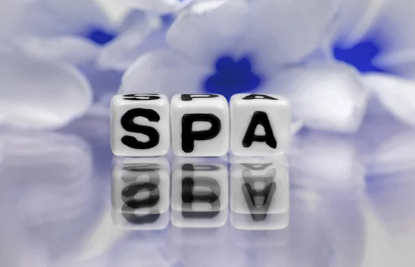 Blue flowers and spa text message — Stock Photo, Image