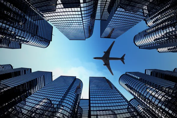 Tours d'affaires avec silhouette d'avion Images De Stock Libres De Droits