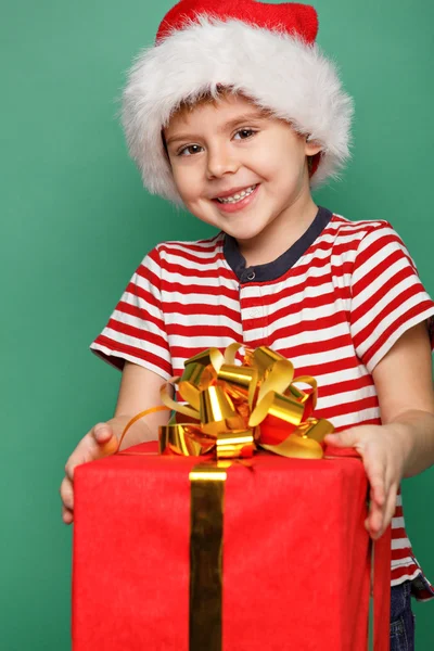 Lustiges Kind in Weihnachtsmannrot — Stockfoto