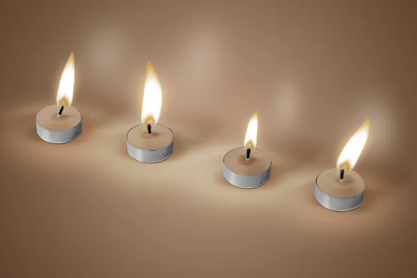 Vier kaarsen op bruine achtergrond — Stockfoto