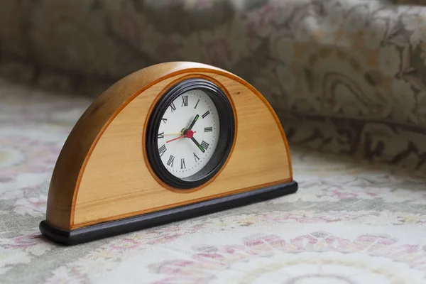 Clock on the table with background — Stock Photo, Image