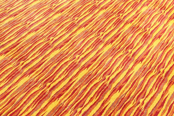 Textura de tapete amarelo e vermelho — Fotografia de Stock