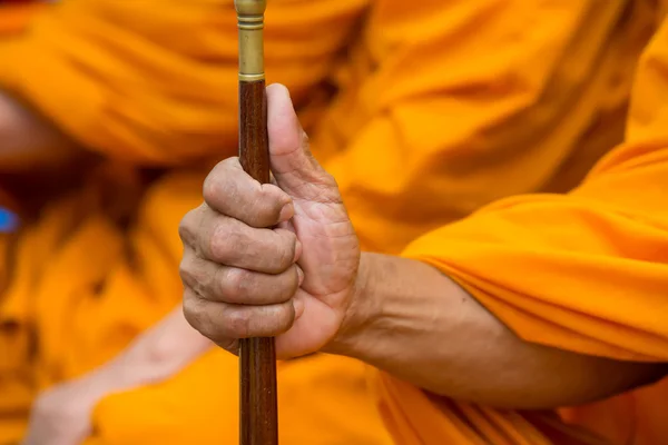 Talipot fan stick in monk's hand — Stock Photo, Image