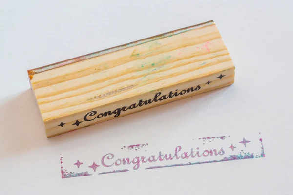 Congratulation stamped on paper — Stock Photo, Image