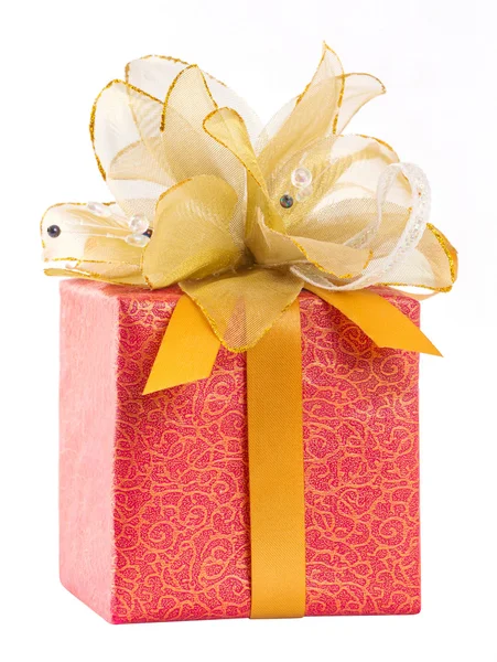 Red gift box with golden bow tie — Stock Photo, Image