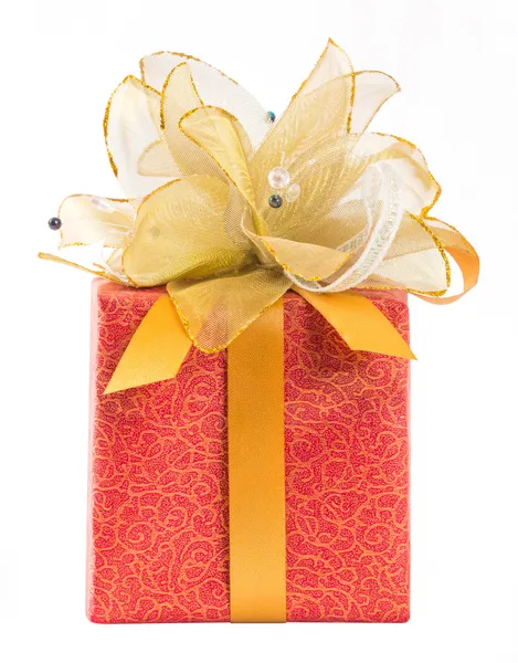 Red gift box with golden bow tie — Stock Photo, Image