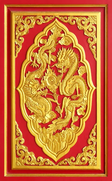 Golden dragon carved from wood — Stock Photo, Image