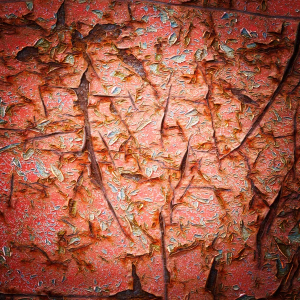 Vignette style red color cracked paint texture — Stock Photo, Image