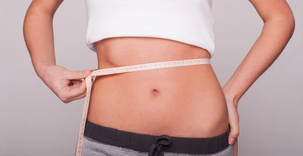 Woman measuring the hips — Stock Photo, Image