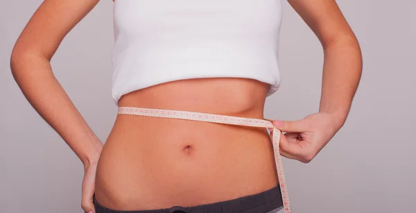 Woman measuring the hips — Stock Photo, Image