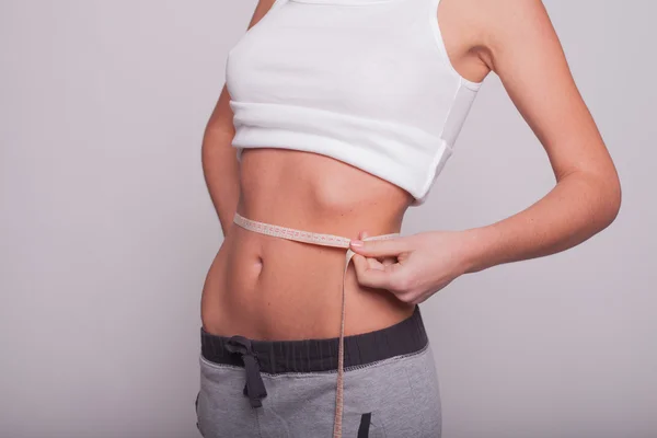 Woman measuring the hips — Stock Photo, Image