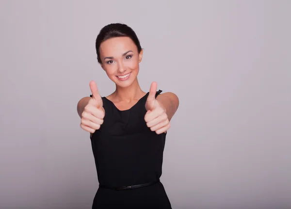 The beautiful brunette shows fingers a class — Stock Photo, Image