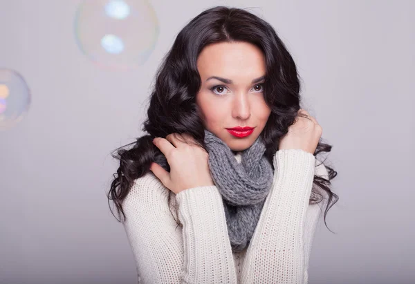 The beautiful girl in a scarf and a warm sweater with red lips — Stock Photo, Image