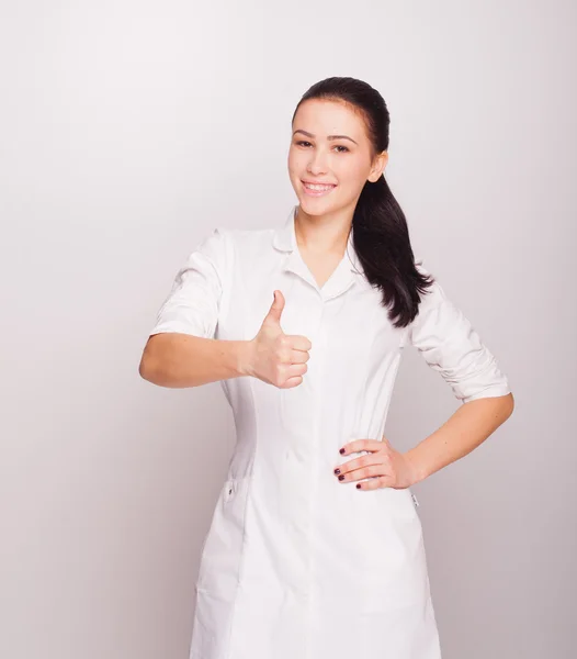 Beautiful brunette doctor in studio — Stock Photo, Image