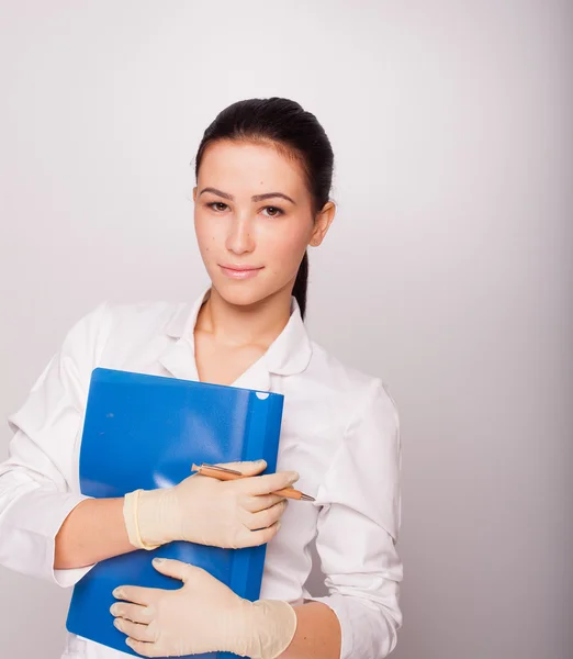 Doctor with blue folder in hands — Stock Photo, Image