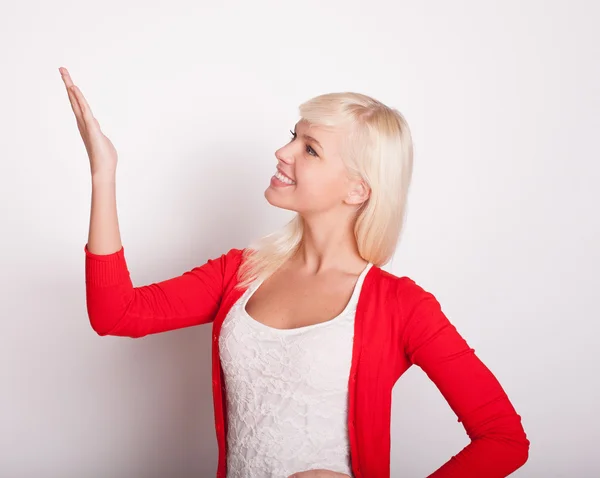 The blonde girl points a finger up — Stock Photo, Image