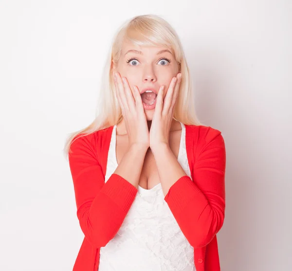 The beautiful fresh blonde the girl is surprised and very glad — Stock Photo, Image