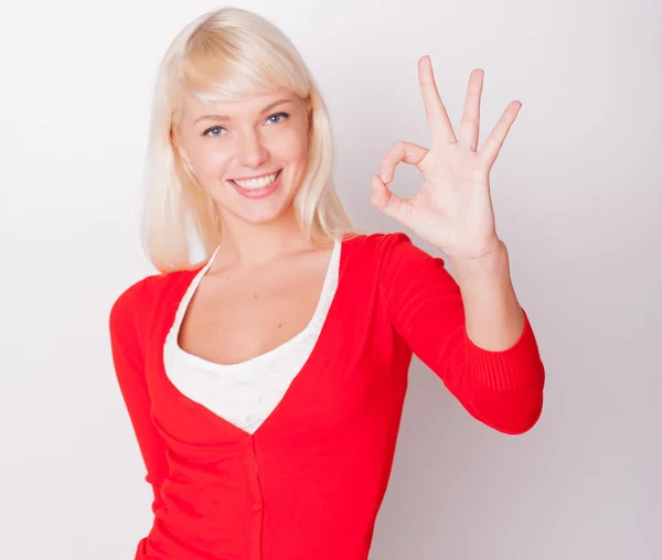 Beautiful blonde shows thumb "ok" — Stock Photo, Image