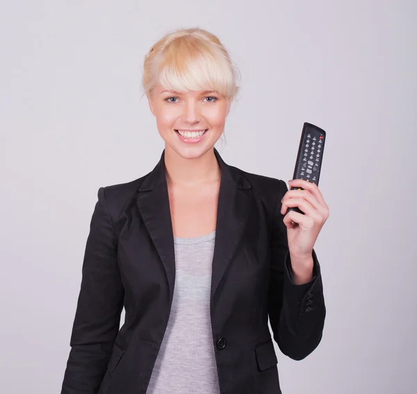 Blonde women with remote control — Stock Photo, Image