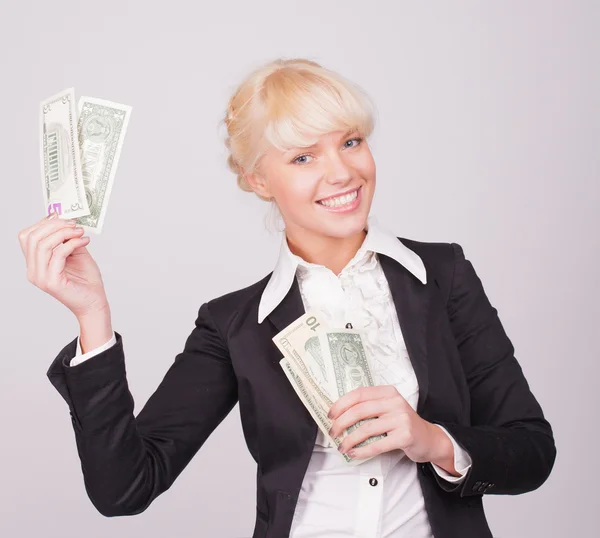 Woman with handful of money — Stock Photo, Image