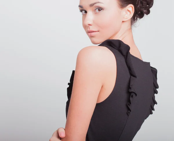 Zakenvrouw in een zwarte jurk — Stockfoto