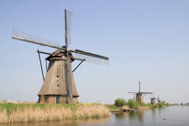 Windmills on the canal bank.