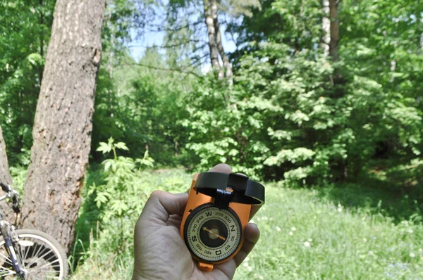 Journey by bike with a compass. — Stock Photo, Image