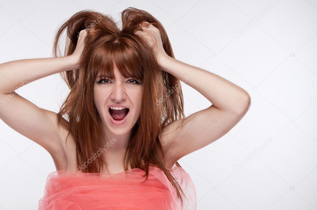 girl screaming and holding his hair