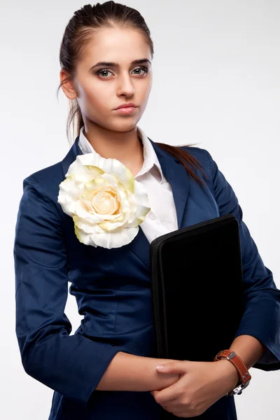 Portrait of a girl with a folder strictly looking straight — Stock Photo, Image