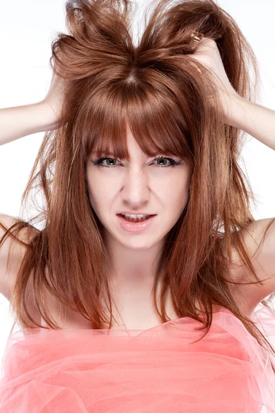 Girl portrait of angry and shoot the breeze at his hair — Stock Photo, Image