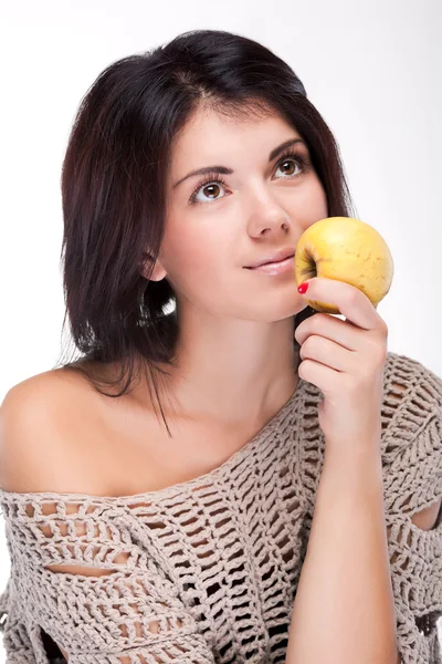Portrait of a girl holding an apple near the mouth — Stock Photo, Image