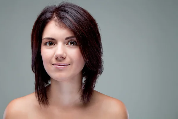 Portrait of a girl looking right with a short haircut — Stock Photo, Image