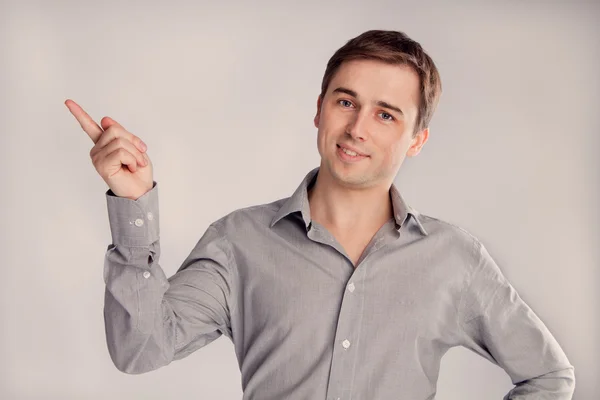 Portrait of a man showing his finger to the side (retro) — Stock Photo, Image