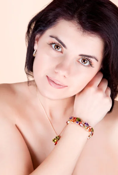 Girl holding hand near face bracelet — Stock Photo, Image