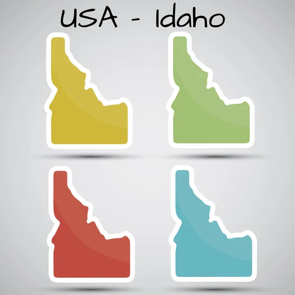 Autocollants en forme d'État de l'Idaho, États-Unis — Image vectorielle