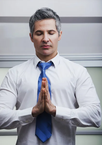 Businessman meditating — Stock Photo, Image