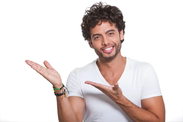 Young man by pointing with both hands — Stock Photo, Image