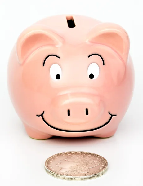 Piggybank found a Silver Dollar — Stock Photo, Image