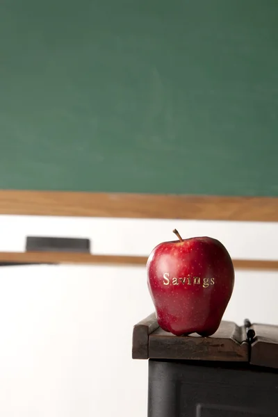 Apple in front of blackboard — Stock Photo, Image