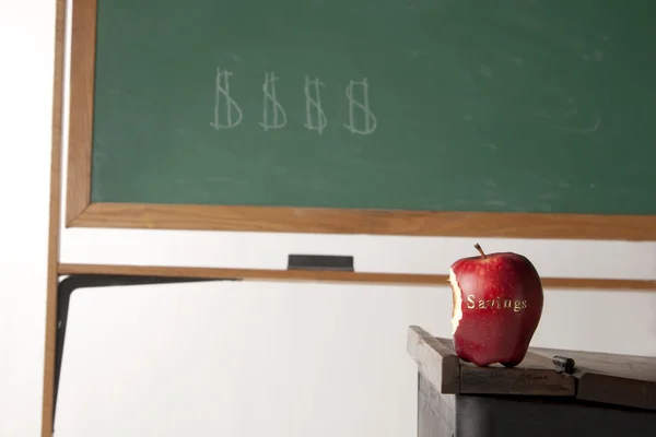 Apple in front of blackboard — Stock Photo, Image